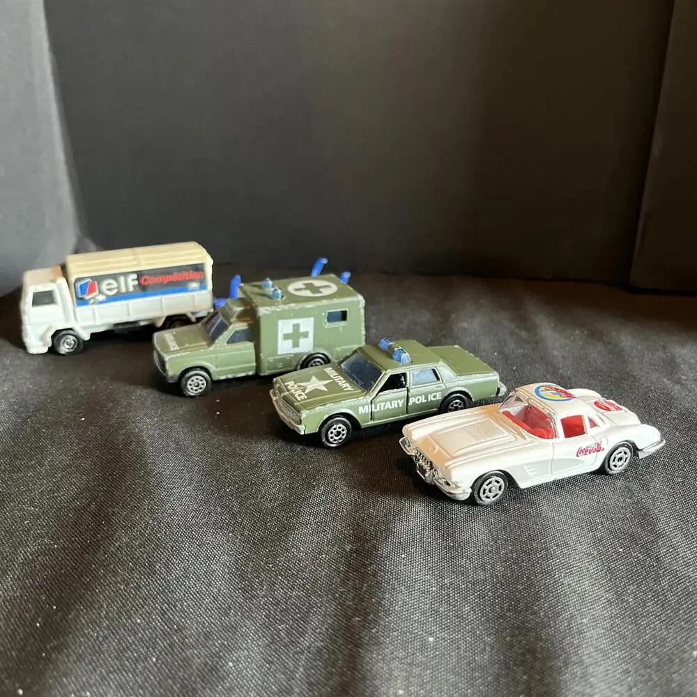 Vtg. Majorette Lot Of 4, ELF Truck, AMBULANCE, MILITARY POLICE & Coke Corvette